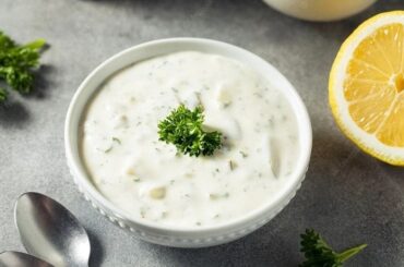 Homemade tartar sauce with mayonnaise, pickles, onion, and parsley