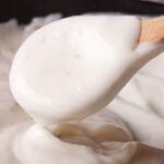 Homemade white sauce bechamel in a pot
