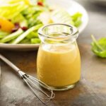 Honey mustard vinaigrette in a small jar