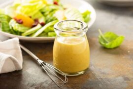 Honey mustard vinaigrette in a small jar