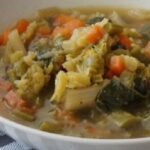 Mapuche yuyo soup with potatoes and wild greens in a bowl