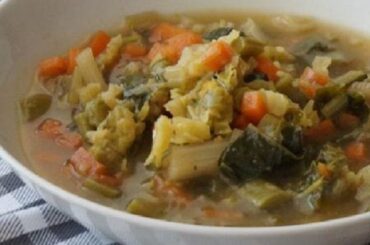 Mapuche yuyo soup with potatoes and wild greens in a bowl