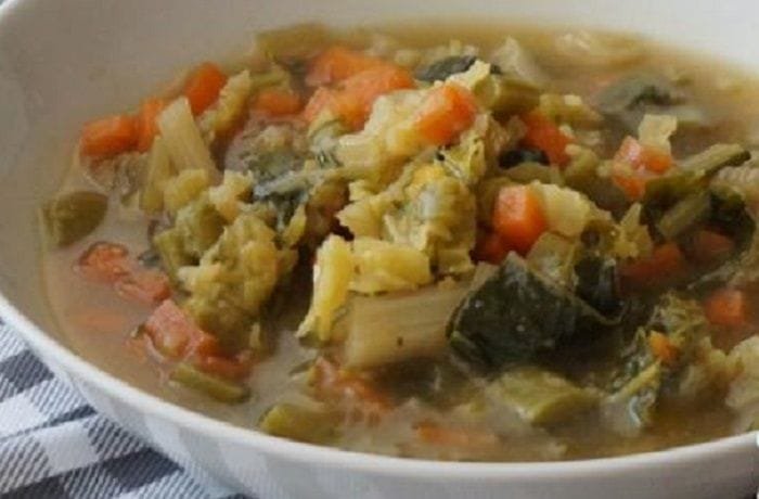 Mapuche yuyo soup with potatoes and wild greens in a bowl
