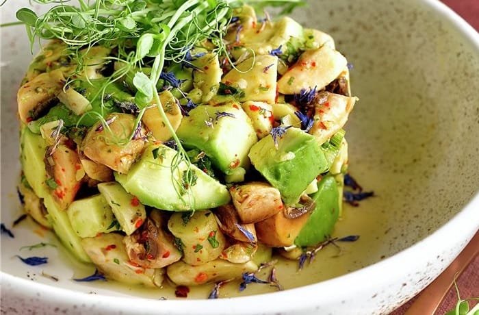 Mushroom ceviche with avocado, cilantro, and red bell pepper