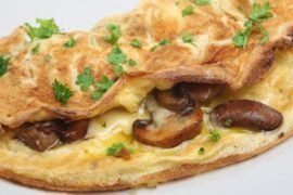 Folded mushroom omelette with parsley