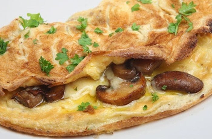 Folded mushroom omelette with parsley