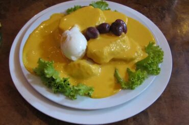 Papas a la huancaína with hard-boiled egg, botija olives and lettuce