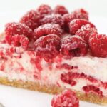 Raspberry cheesecake topped with fresh Chilean raspberries