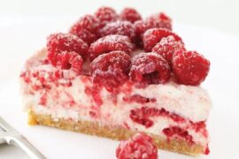 Raspberry cheesecake topped with fresh Chilean raspberries
