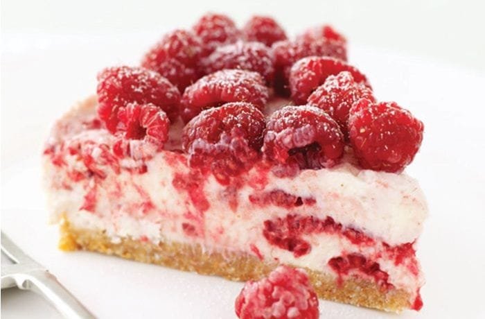 Raspberry cheesecake topped with fresh Chilean raspberries