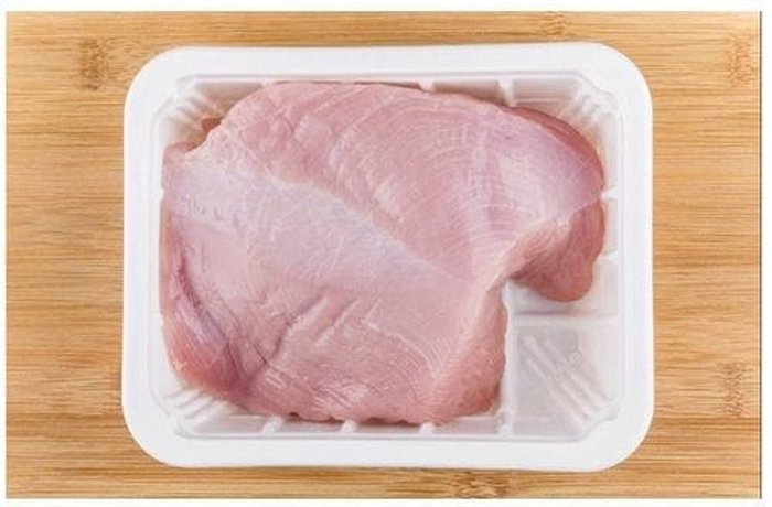 Raw turkey breast ready to butterfly and stuff