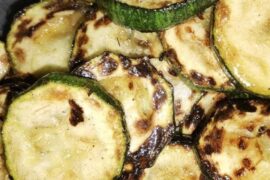 Sautéed zucchini slices with garlic and oregano
