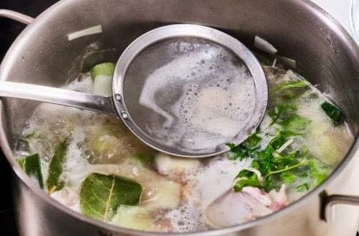 Simmering homemade fish fumet