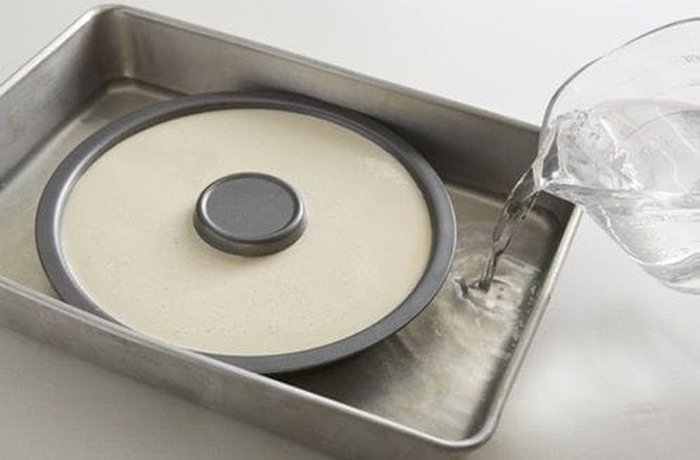 Mold in a water bath to bake Chilean crema volteada in the oven