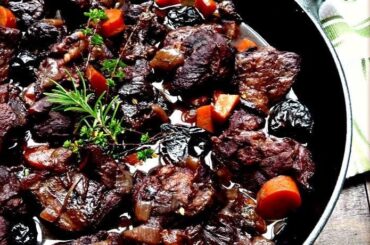 Wild boar stew braised in red wine with potatoes and carrots