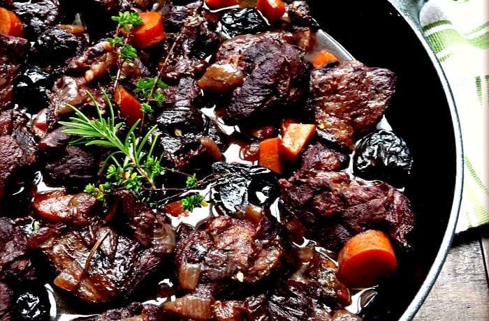 Wild boar stew braised in red wine with potatoes and carrots